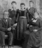 Portrait of Jacob Von Allmen Jr. and wife Anna (Balmer) and three daughters.